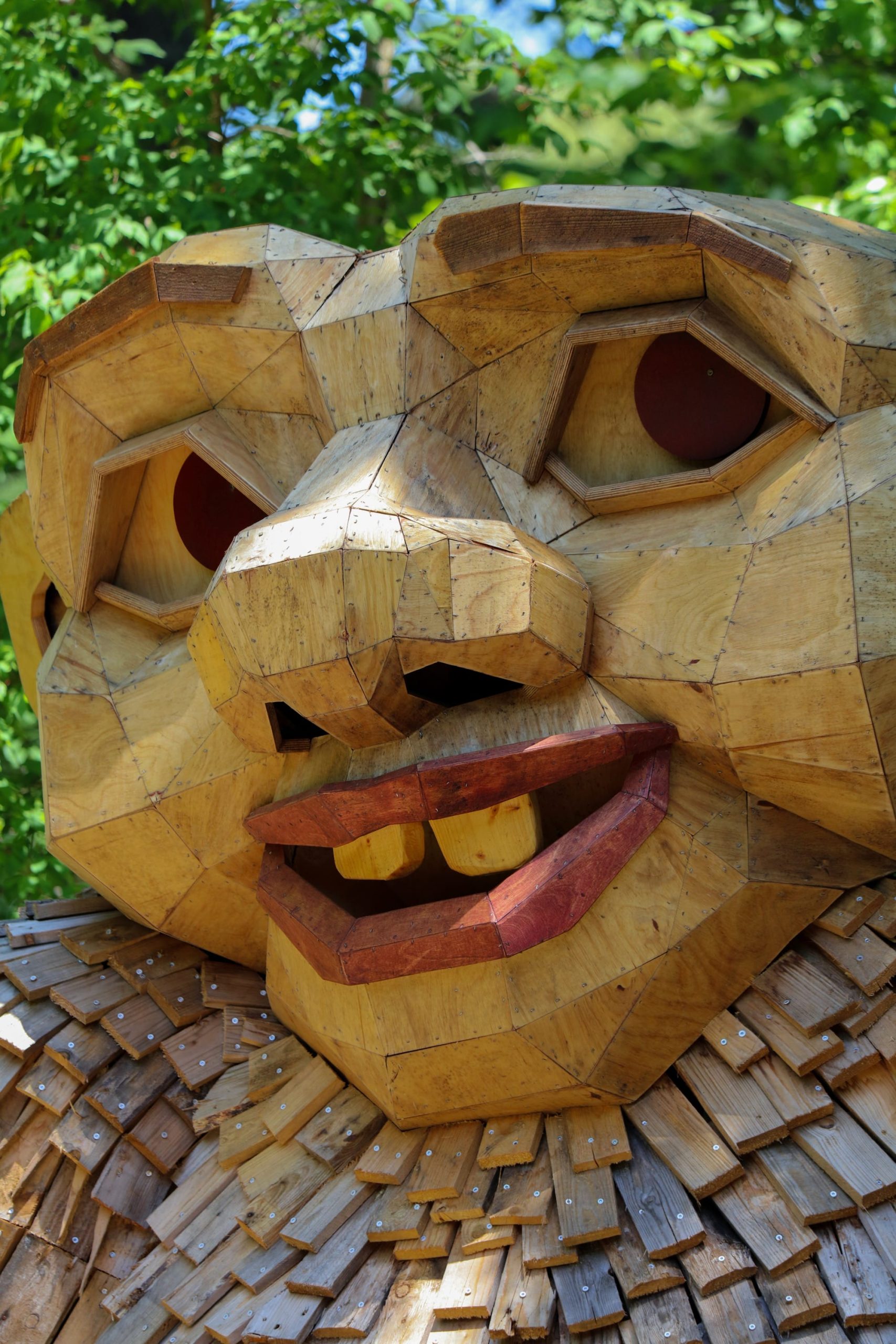 a close up of a wooden troll