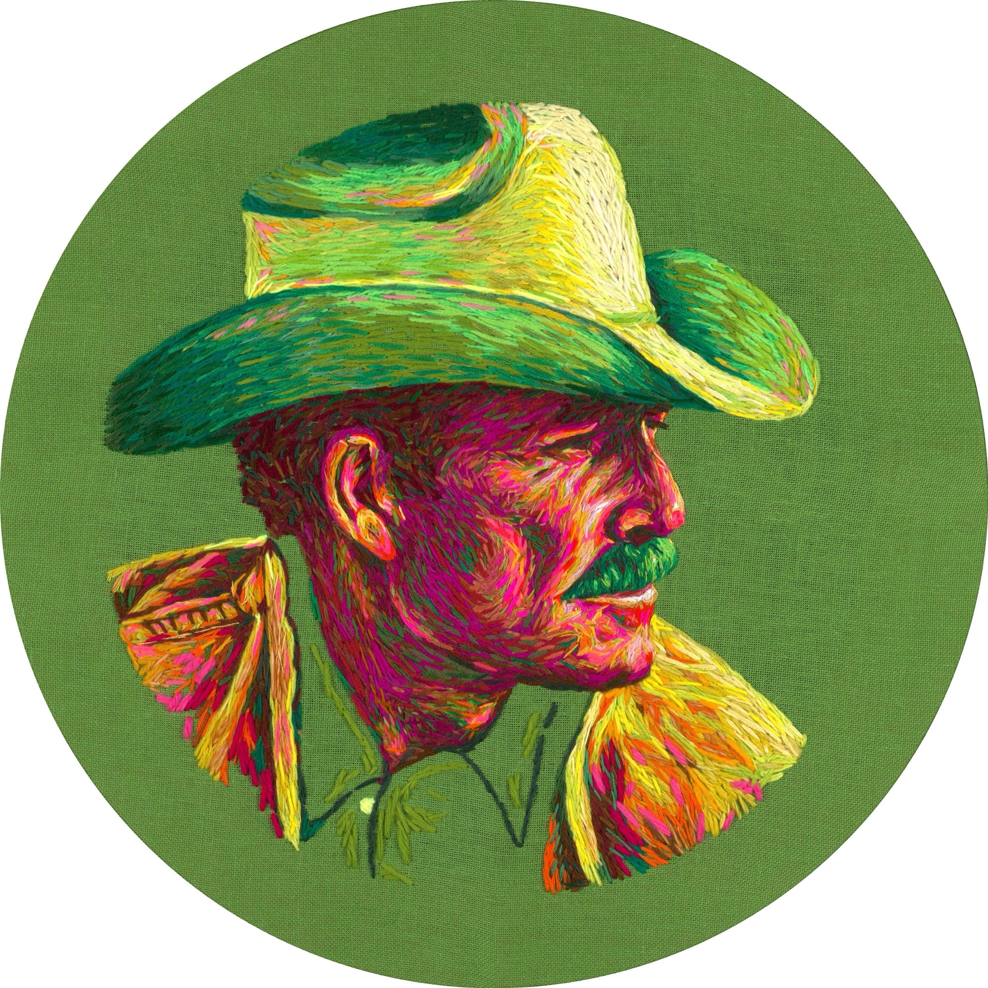 a circular crewel embroidery composition by Danielle Clough of a man in a cowboy hat on a green background