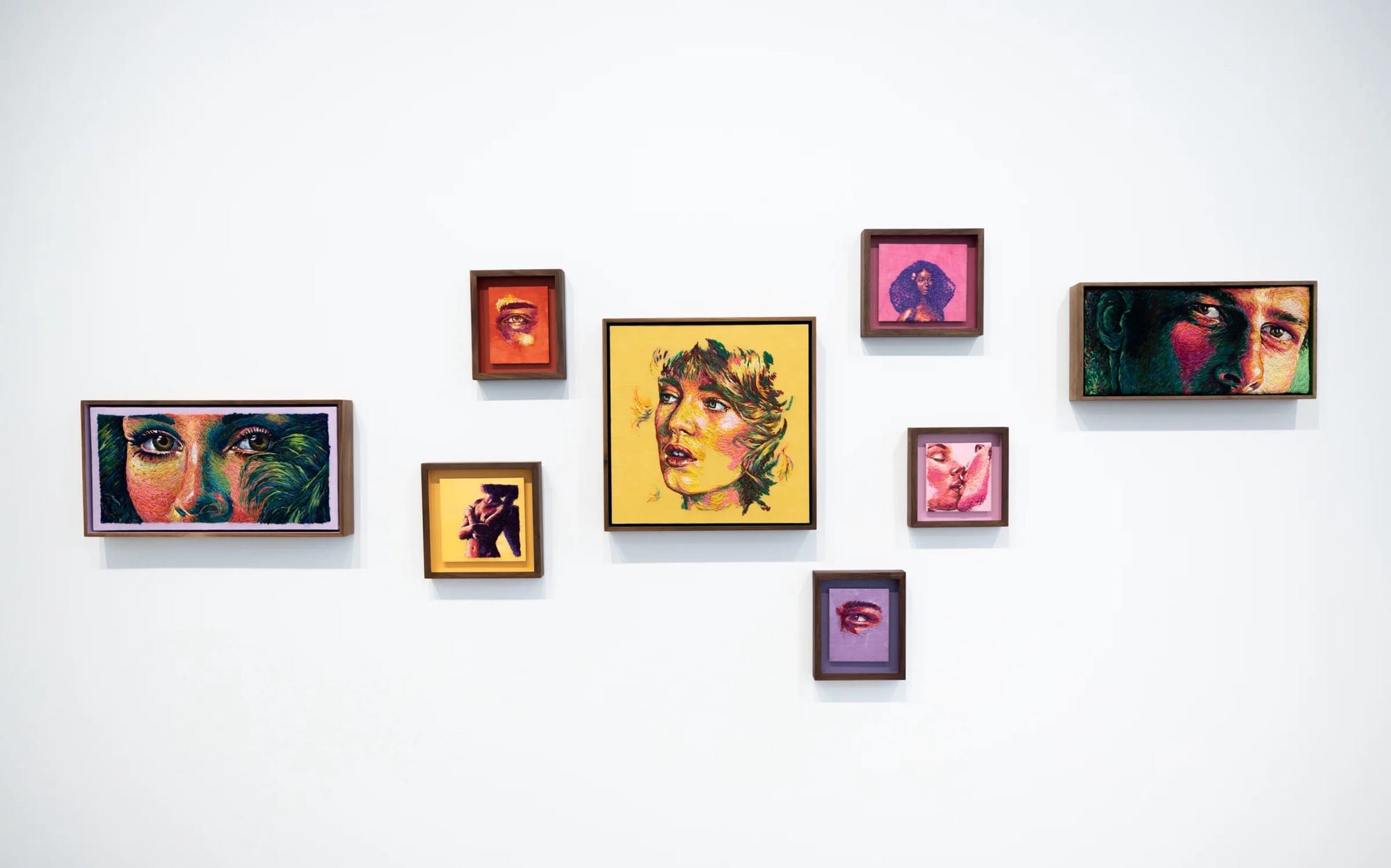 an installation of eight framed embroidery pieces by Danielle Clough
