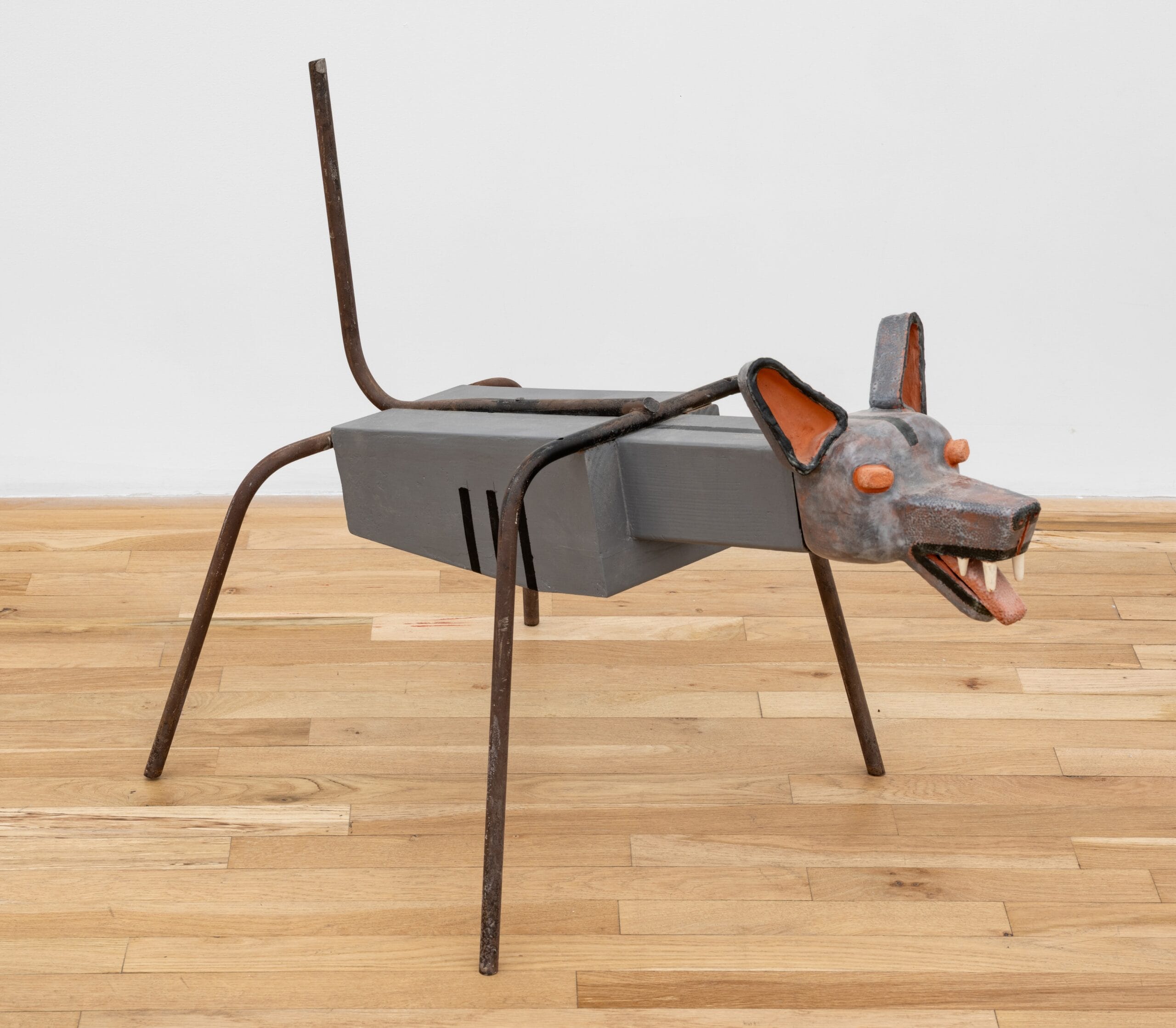 a sculpture by Steve Keister of a blocky, cartoonish gray canine