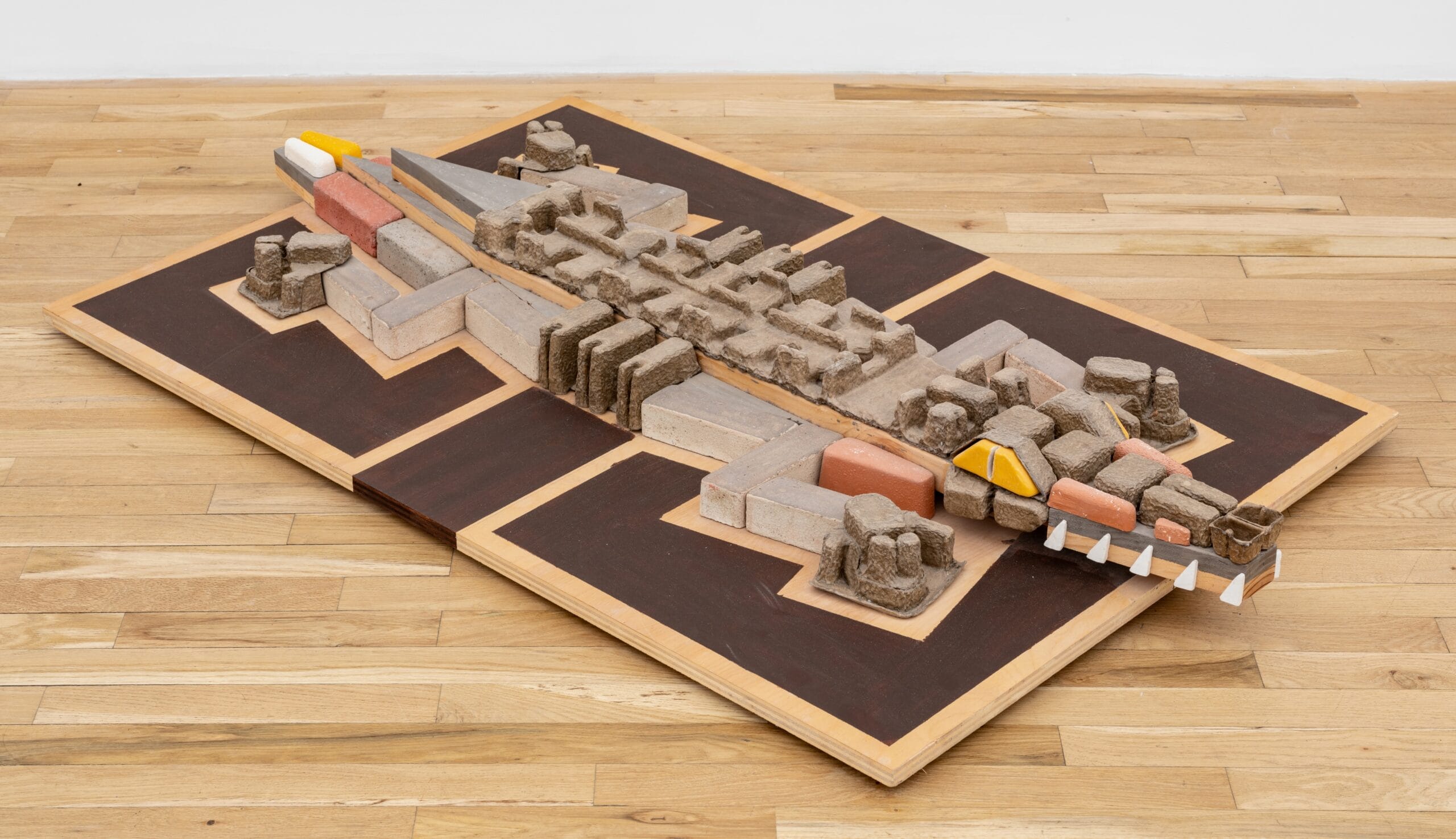 a floor sculpture by Steve Keister of an abstract crocodile