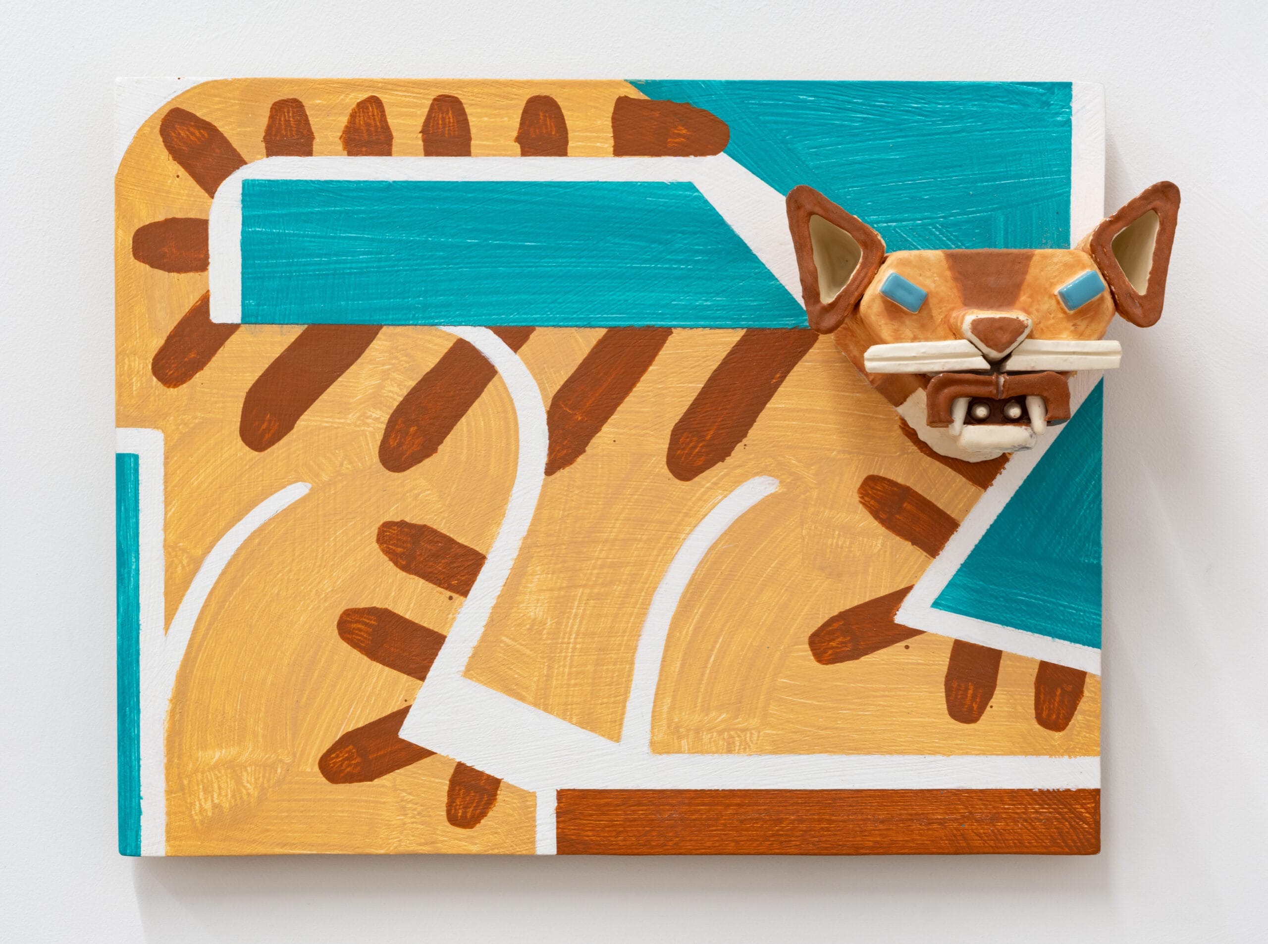 a wall relief painting by Steve Keister of a blocky, cartoonish big cat