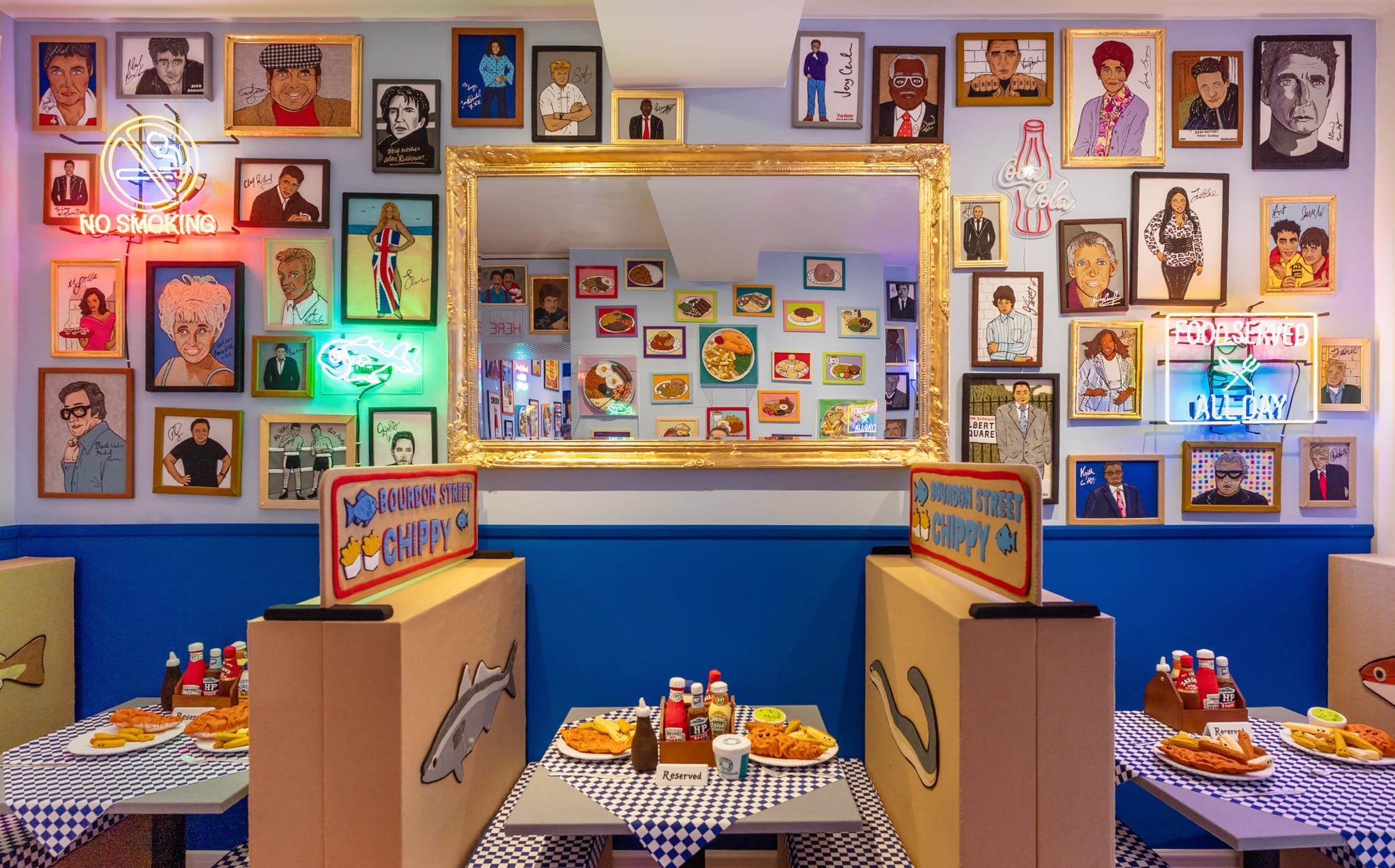 tables in an art installation of a fish and chip shop made entirely of felt