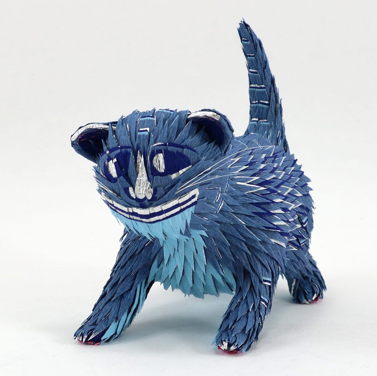 a tiny blue cat pinata by Roberto Benavidez