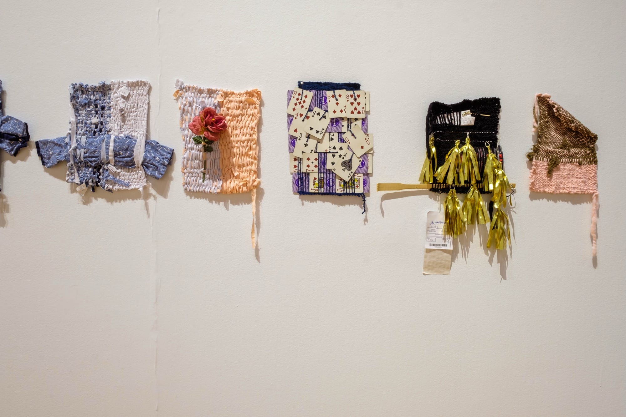 small weavings by Bryana Bibbs in a gallery at the Haggerty Museum of Art