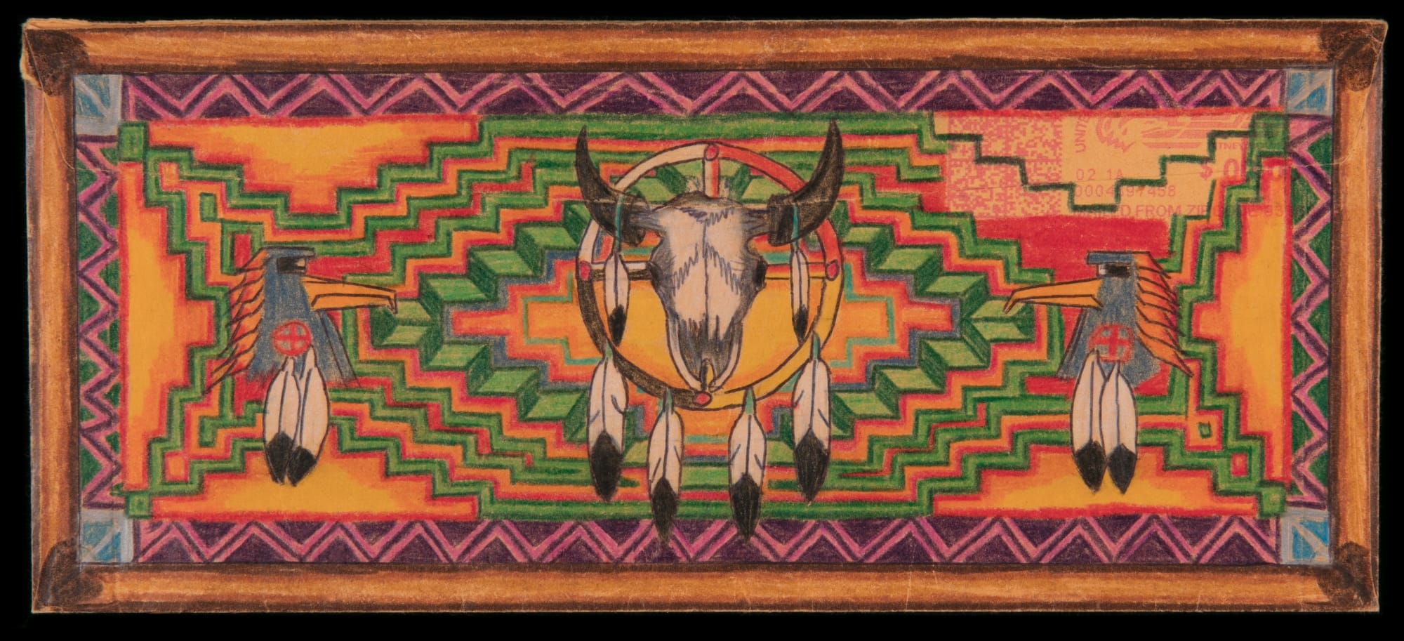 an envelope with a bright chevron pattern and buffalo skull with feathers dangling from it