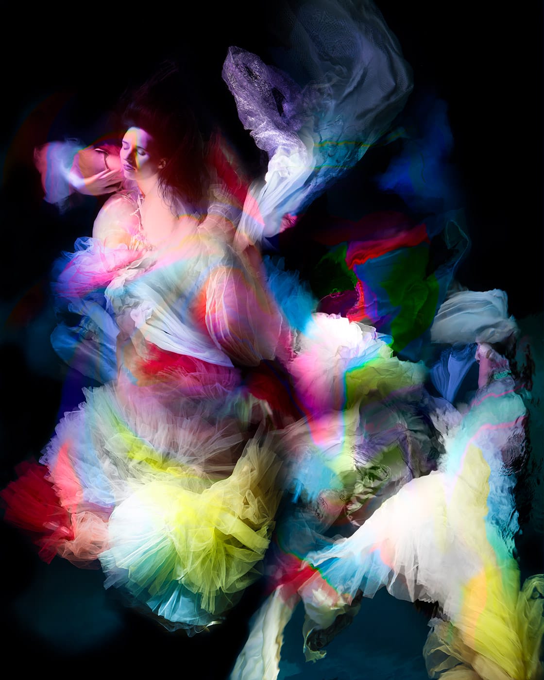 an underwater photograph by Christy Lee Rogers of figures enveloped in billowing fabric