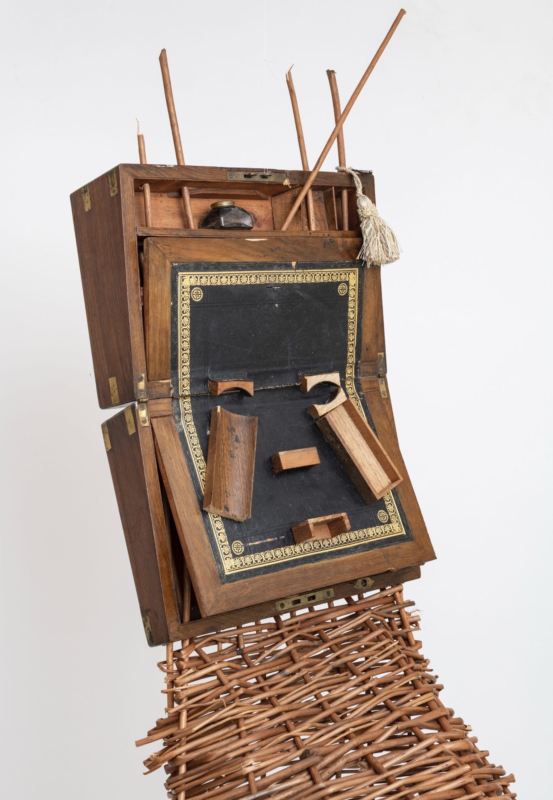 Antique Writing Desks Converge with African Masks in Sonia E. Barrett’s Sculptures