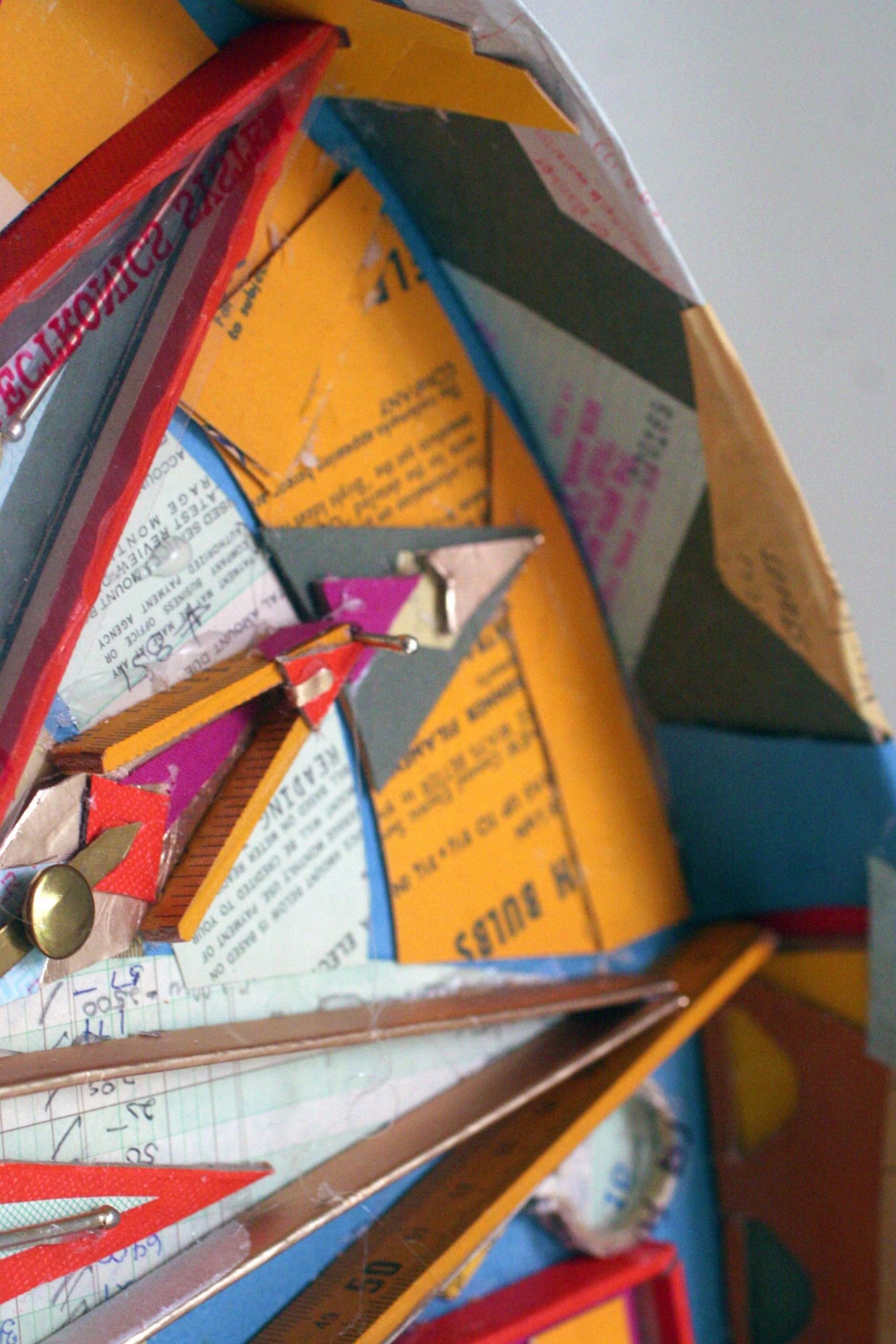 a detail of an abstract clock made from scraps by Lydia Ricci