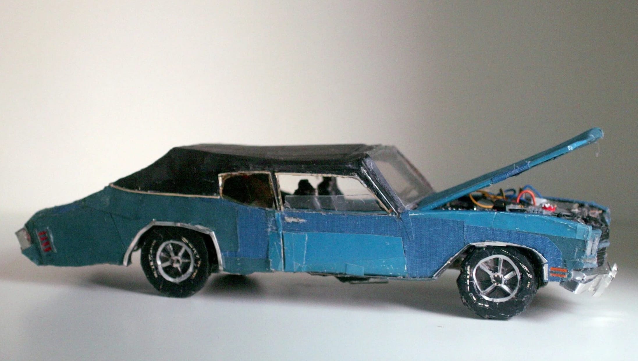 a blue vintage car made from found scraps by Lydia Ricci