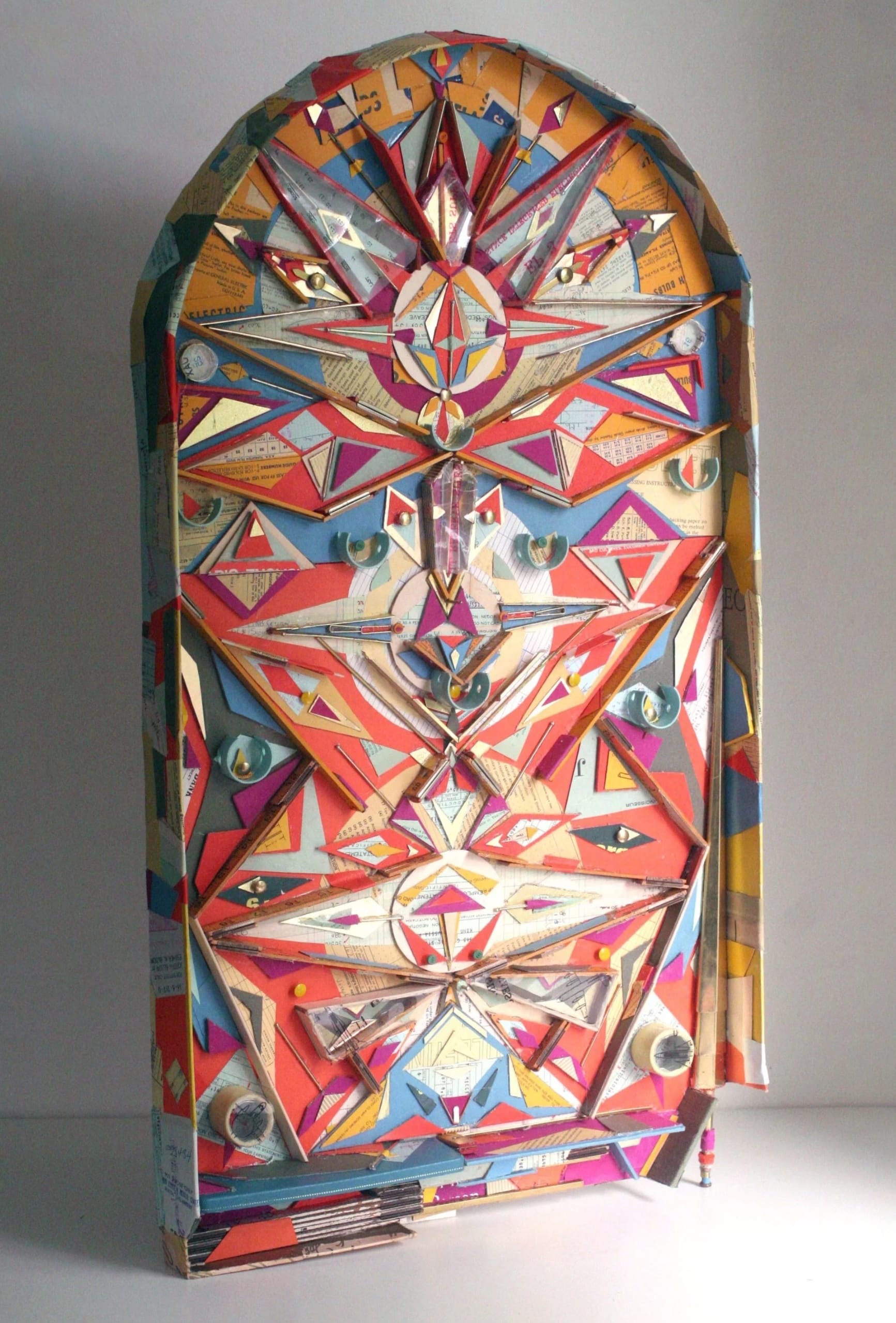 an abstract clock made from scraps by Lydia Ricci